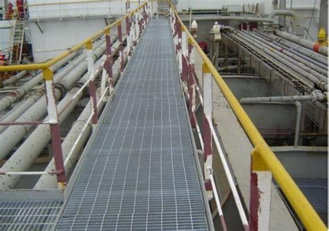 A close-up of different metal grating types: galvanized steel, stainless steel, and aluminum