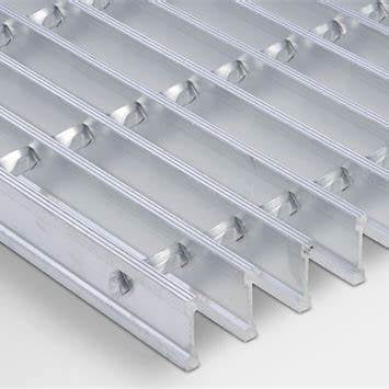 A modern architectural walkway using lightweight aluminum grating